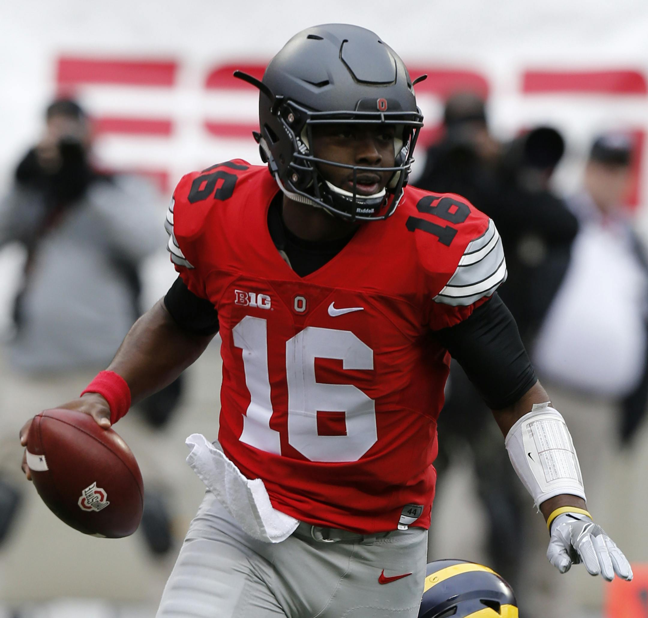 Ohio State quarterback J.T. Barrett plays against Michigan in an NCAA college football game Saturday, Nov. 26, 2016, in Columbus, Ohio. (AP Photo/Jay LaPrete) ORG XMIT: otk_fbc_11262016_004