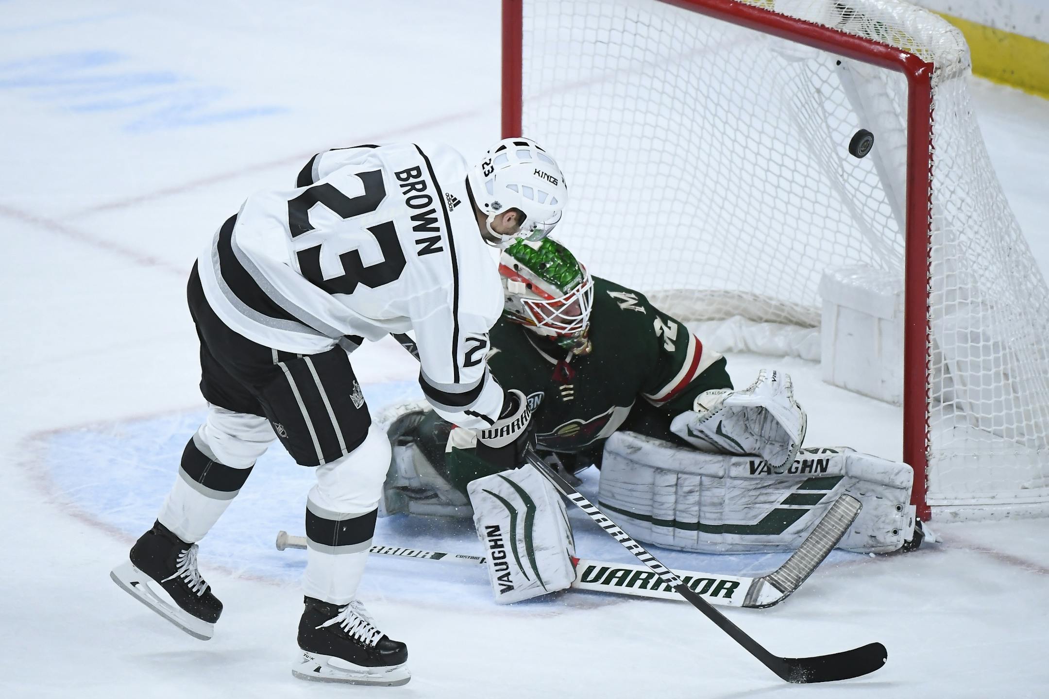 Minnesota Wild goaltender Alex Stalock (32) eneded Tuesday night's shootout with a save on a shot by Los Angeles Kings right wing Dustin Brown (23).