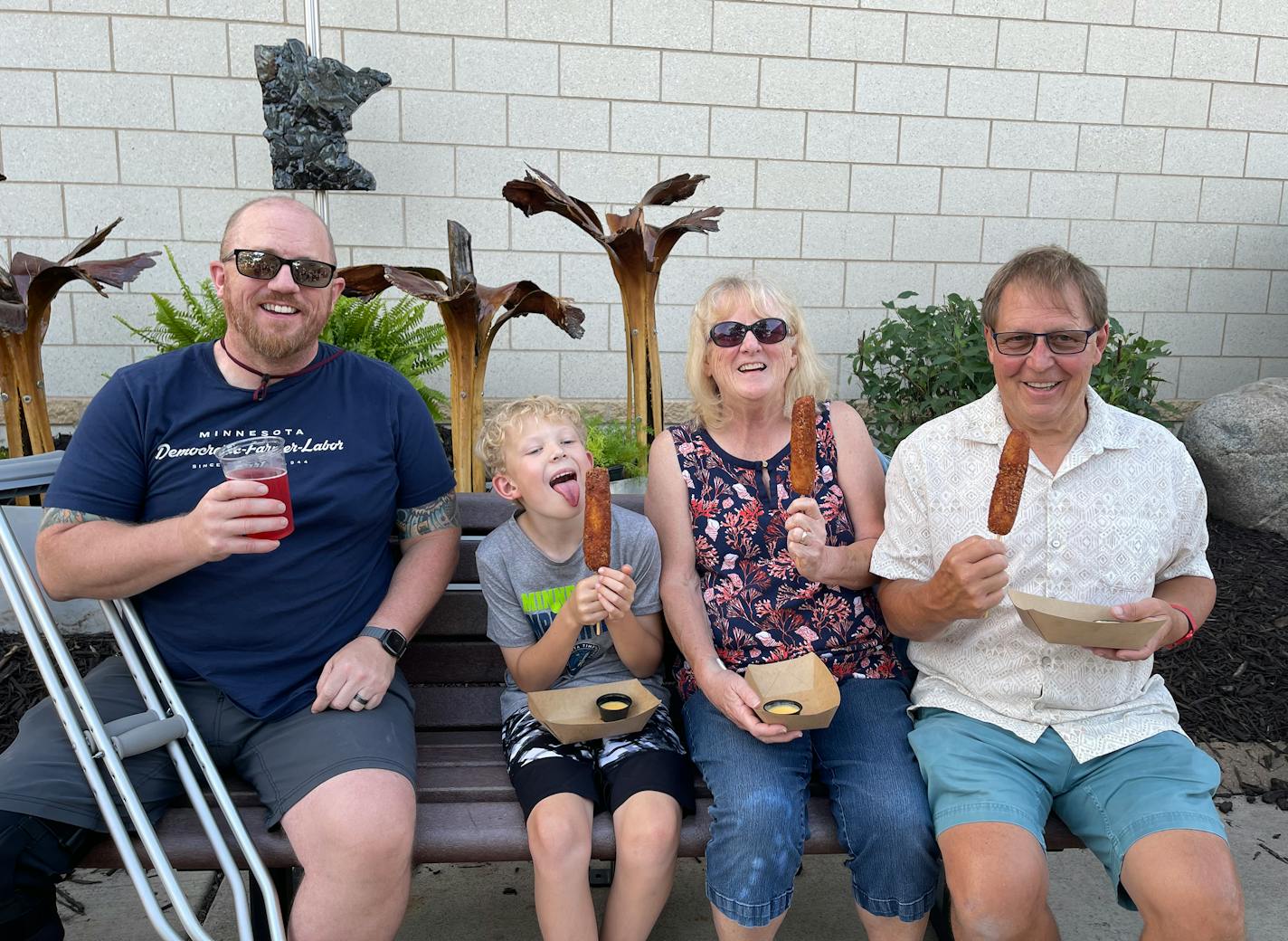 Mary Zadach with her family (from left) son Uriah Blatherwick, grandson Graham Blatherwick and husband Paul Zadach at LuLu's Public House eating a Tot Dog, which Mary Zadach created. Provided photo