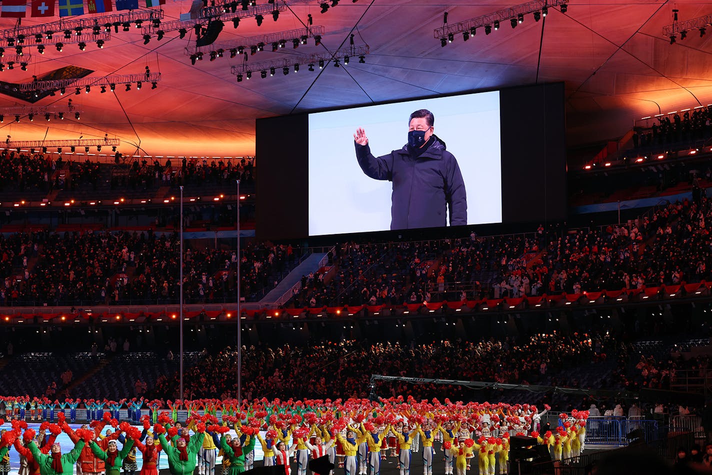 Xi Jinping, President of China is seen waving on the big screen as dancers perform during the Opening Ceremony of the Beijing 2022 Winter Olympics at the Beijing National Stadium on Feb. 4, 2022, in Beijing, China. (Lintao Zhang/Getty Images/TNS) ORG XMIT: 39302411W ORG XMIT: MIN2202040926070046