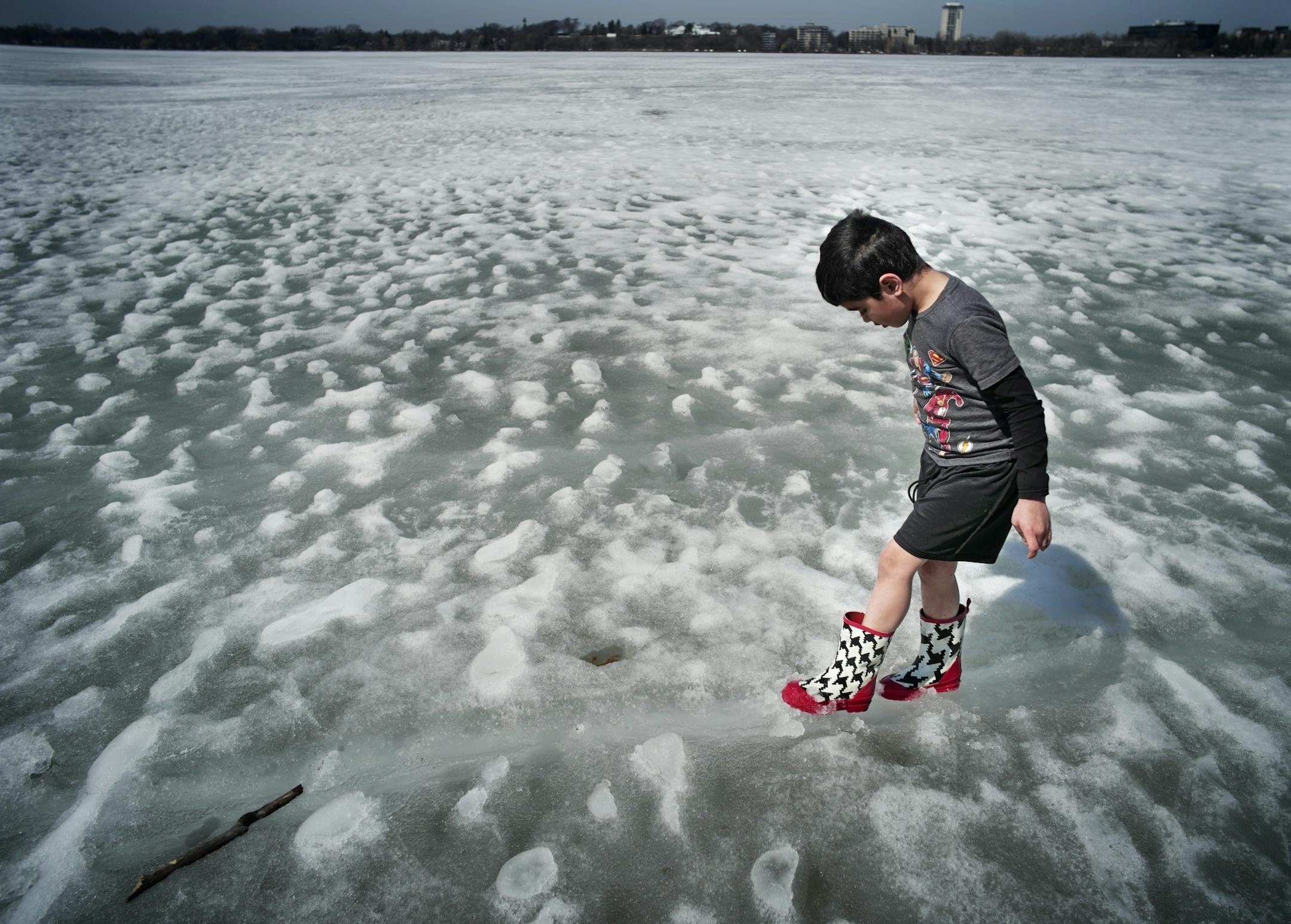 Gideon Frohlich,7 was literally testing the ice on Bde Maka Ska along the shoreline. He is home schooled part time and was enjoying the warm weather with his three siblings and his mother Angelina.