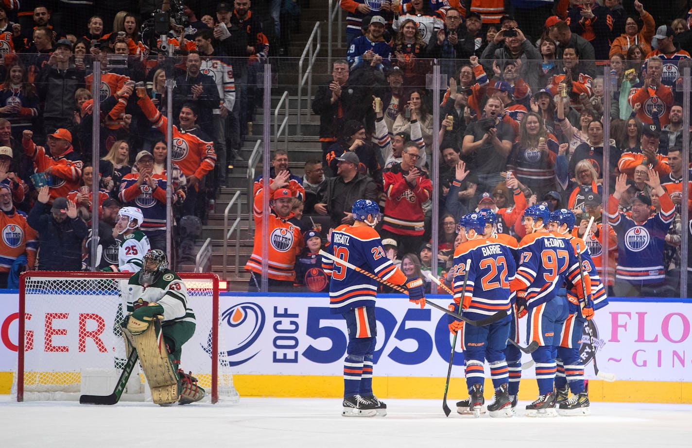 Oilers players celebrate a goal against the Wild during Friday's first period