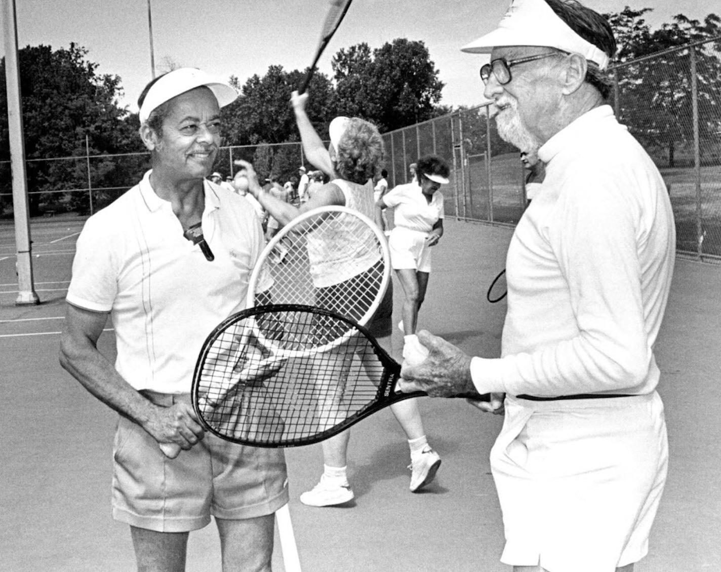 June 17, 1986 Seniors tennis program, Wolfe Park, St. Louis Park. Percy Hughes, left, with Jack Dow, retired advertising & printing executive. Other seniors practice serves in background. June 22, 1986 Art Hager, Minneapolis Star Tribune