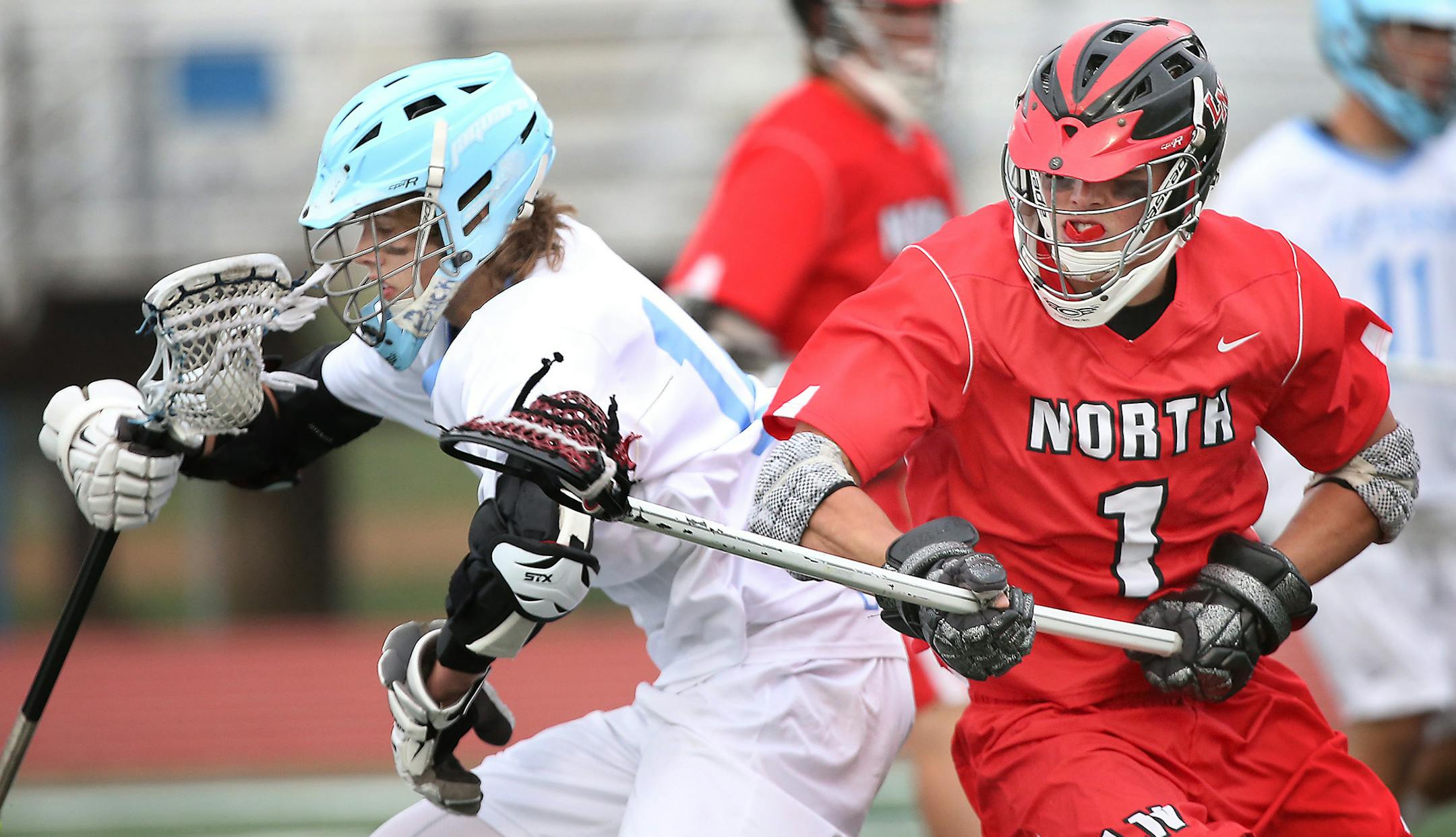 Bloomington's Ryan Graff kept possession of the ball despite defensive pressure by Lakeville North's Dakota Toedter in the first quarter during the boys' lacrosse state semifinals at Hopkins High School, Thursday, June 11, 2015 in Hopkins, MN. ] (ELIZABETH FLORES/STAR TRIBUNE) ELIZABETH FLORES • eflores@startribune.com
