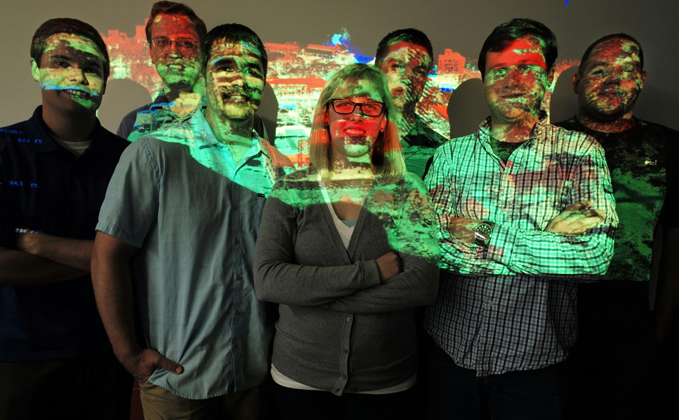 Landscape imagery is projected on master’s degree students in a geographic information science lab at the University of Minnesota on July 21, 2014. The group used landscape data to develop a Web application to calculate the solar energy potential for every square meter of Minnesota. From left are Devon Piernot, Michael Moore, Andrew Walz, Molly McDonald, Chris Martin, Stephen Palka, and Ben Gosack. Richard Tsong-Taatarii/Star Tribune
taatarii@startribune.com