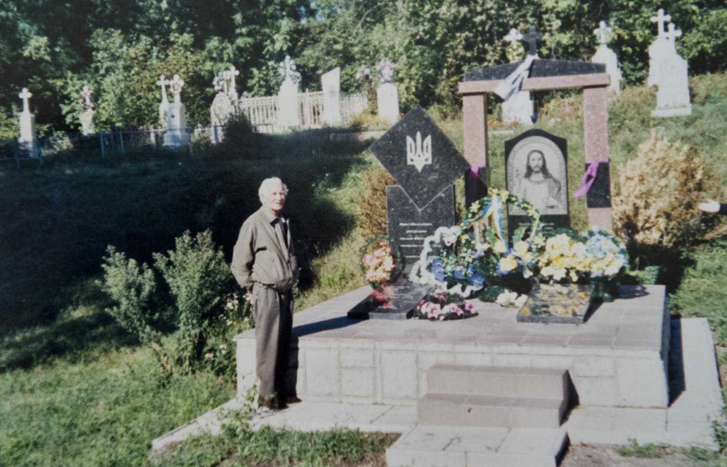 When Michael Karkoc deserted from the German army, the Nazis retaliated by killing 12 people in his Ukrainian village. In 2002 he paid for this memorial to them. His brother Peter stands next to it. Andrij Karkoc defended his father 94-year-old Michael Karkoc against charges that he was a war criminal and committed atrocities working with the Nazi SS. Andrij showed items in his parents Minneapolis home to show his father's strong ties to the Ukrainian and to the U.S. Wednesday, July 10, 2013.