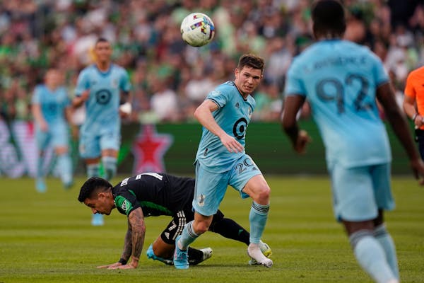 Minnesota United midfielder Wil Trapp (20) moved the ball past Austin FC forward Sebastian Driussi (7) during Sunday’s match.