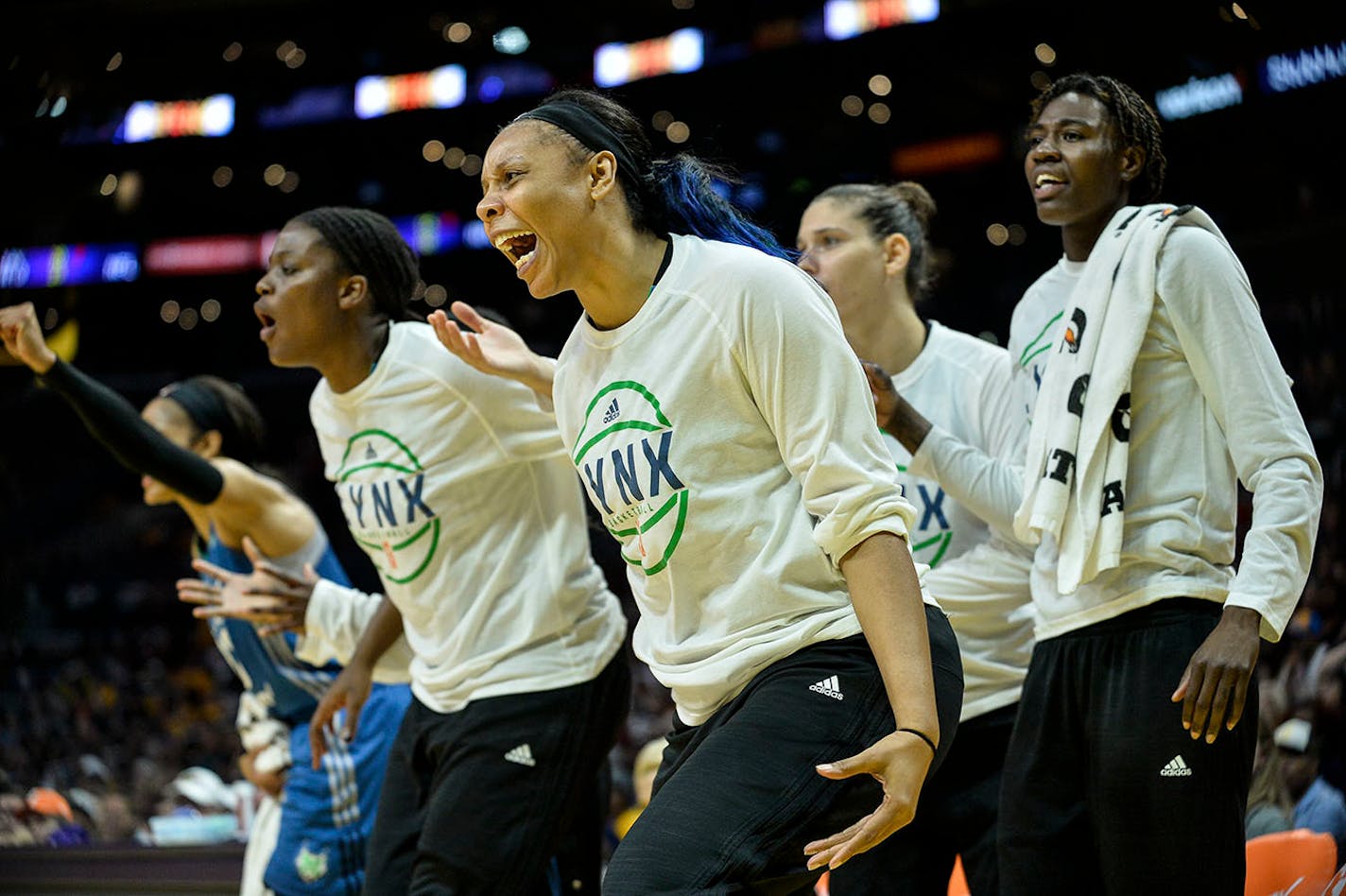 The Minnesota Lynx bench, including forward Plenette Pierson, center, celebrated a 3-point basket by guard Renee Montgomery in the first quarter of Game 4.