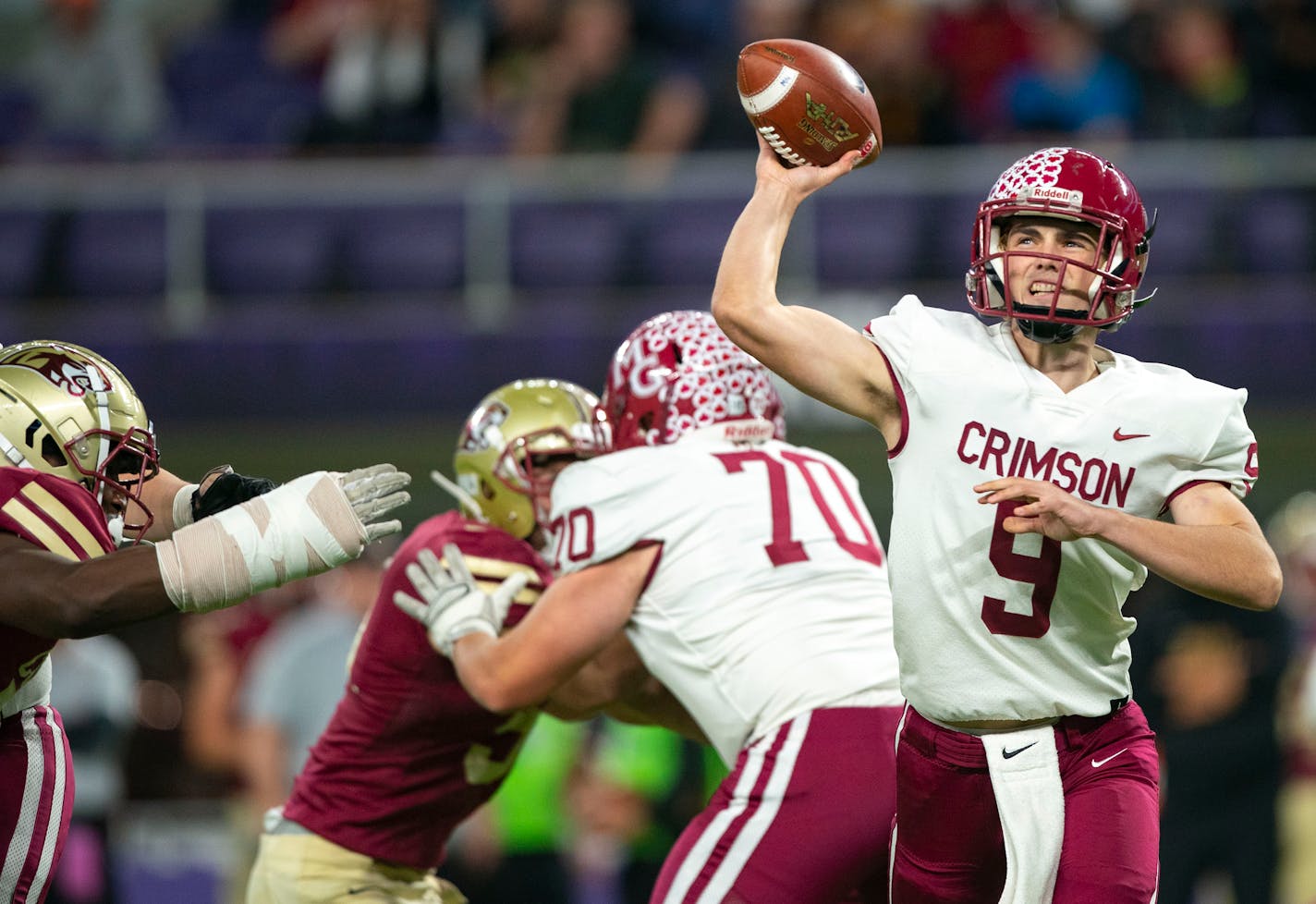 Maple Grove High School quarterback Jacob Kilzer (9) throws a pass against Lakeville South High School in the third quarter in the Minnesota High School football Class 6A State Championship Friday, Nov. 26, 2021 at U.S. Bank Stadium in Minneapolis. ]