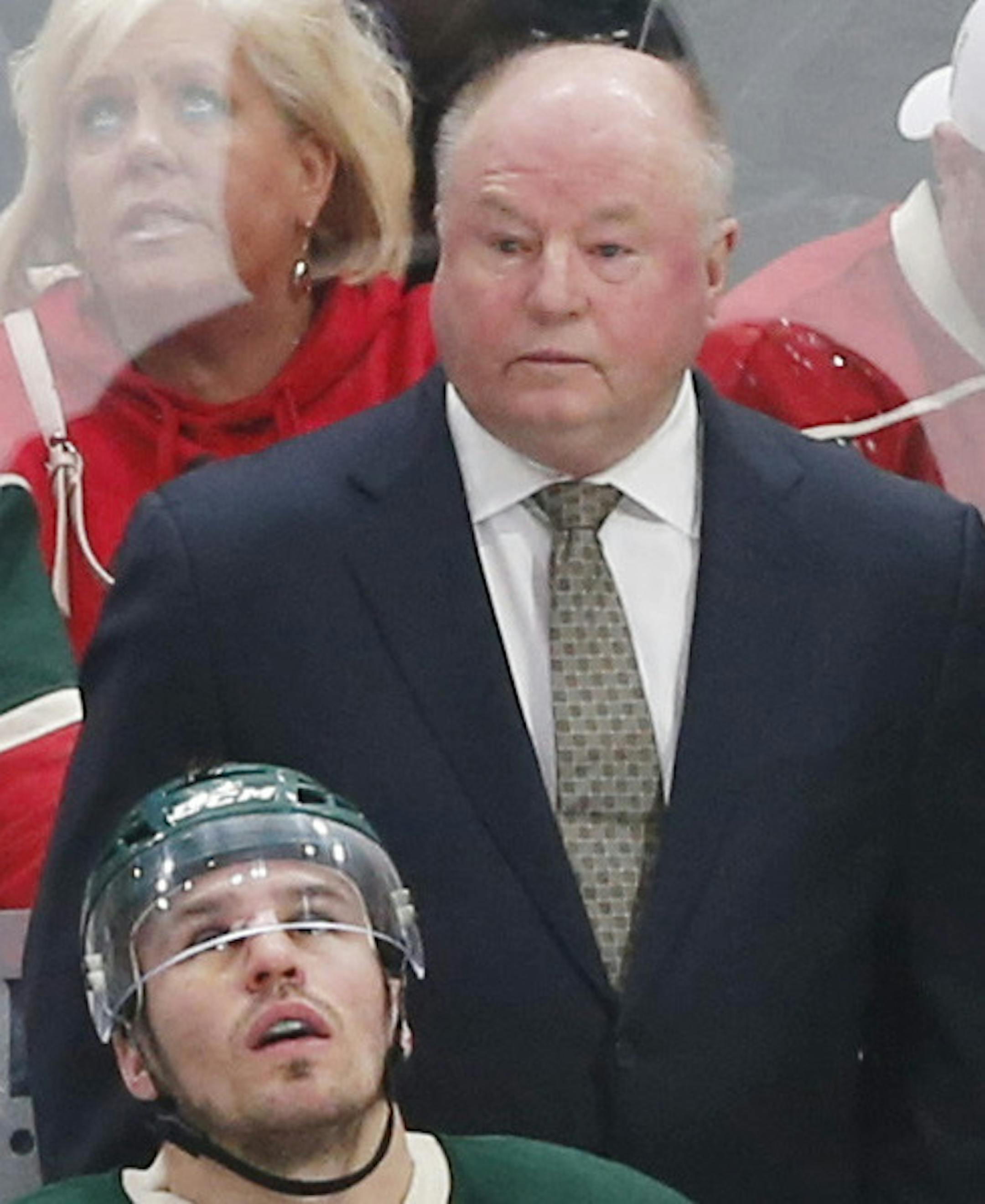 Minnesota Wild head coach Bruce Boudreau, center, watches during during the second period of Game 1 of an NHL hockey first-round playoff series against the St. Louis BluesWednesday, April 12, 2017, in St. Paul, Minn. (AP Photo/Jim Mone) ORG XMIT: MNJM10