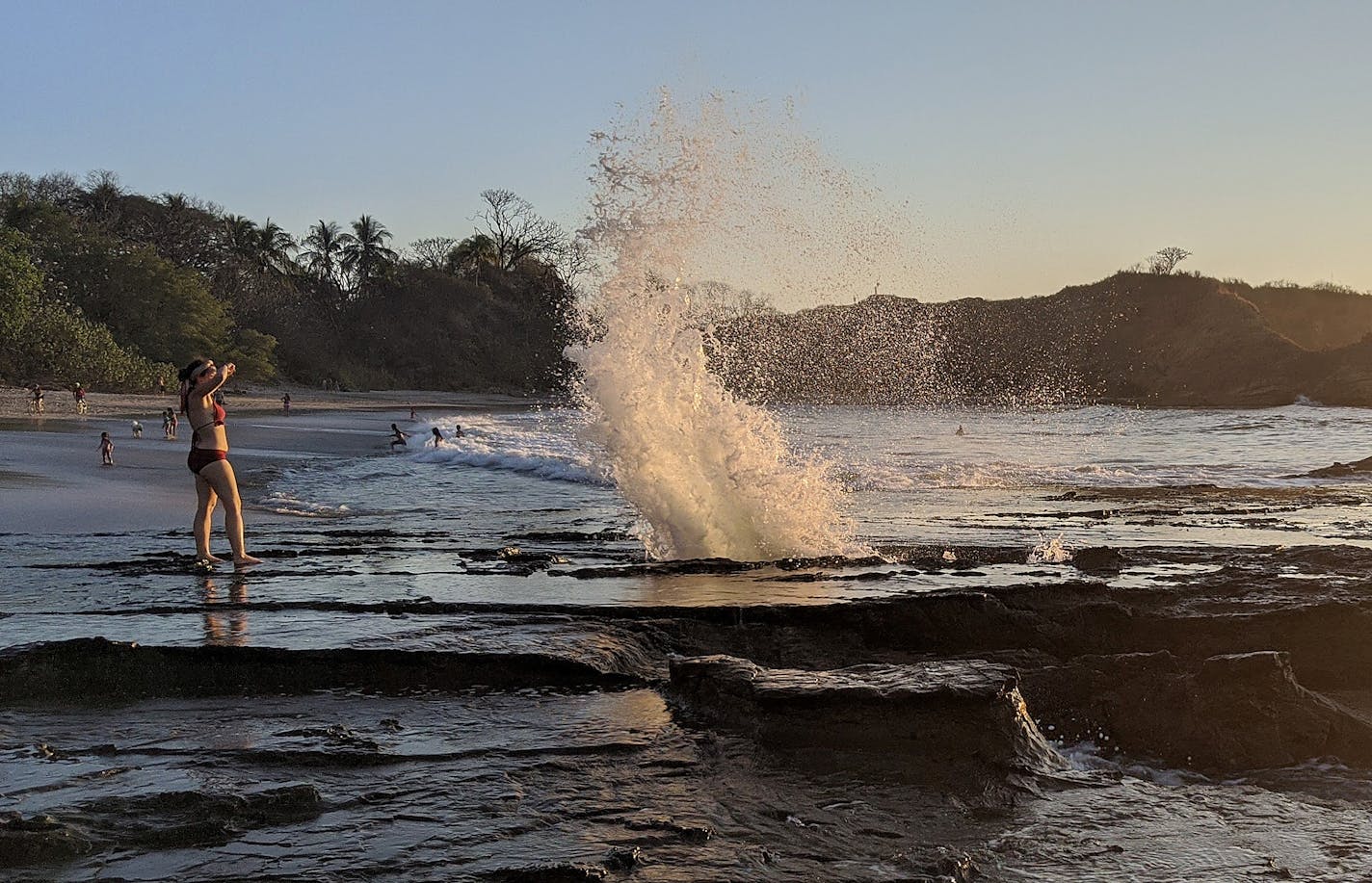 Pacific waves burst though a tidal blowhole at Playa Pelada in Nosara, Costa Rica.