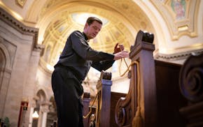 Fr. John Ubel roped off two pews, leaving every third one open, according to a seating chart to evenly space 250 parishioners for this weekend's Mass 