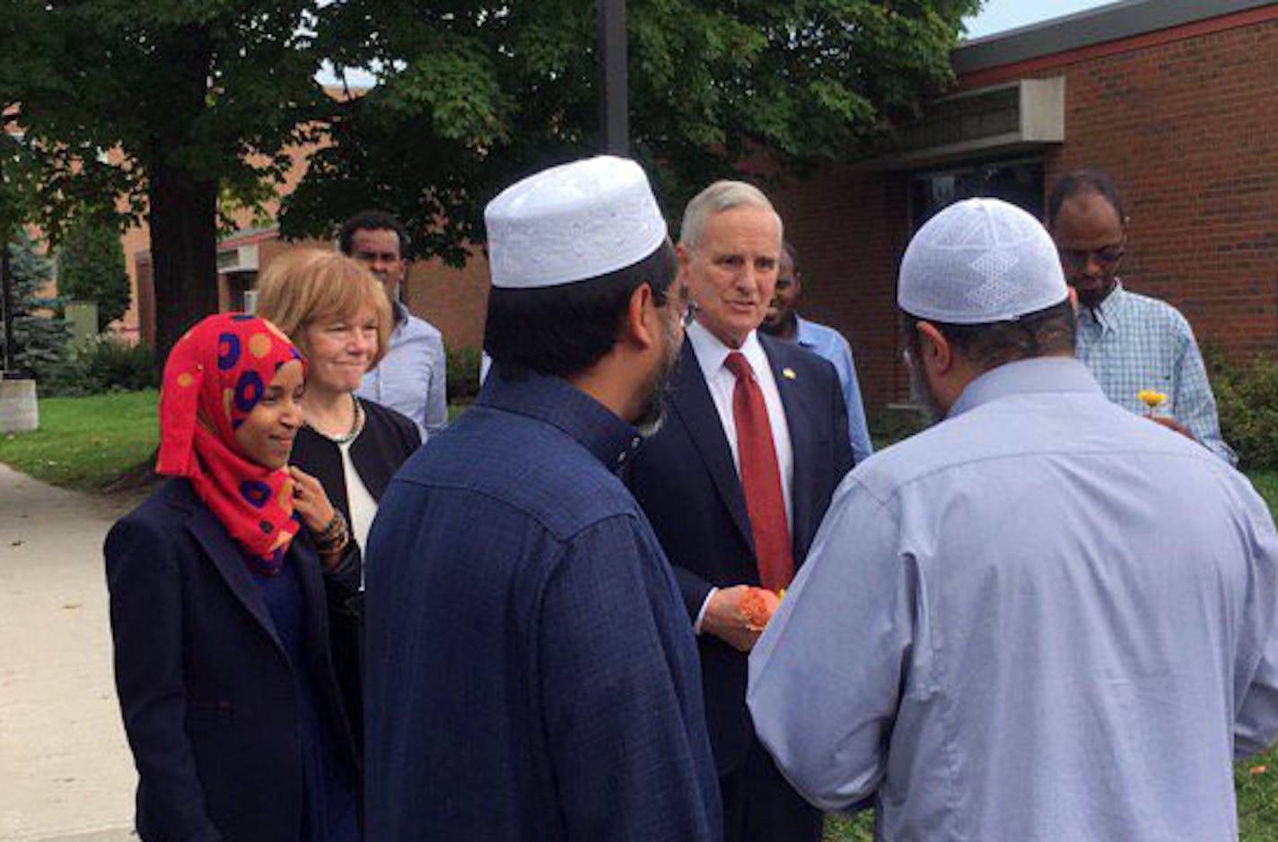 Gov. Mark Dayton, Lt. Gov. Tina Smith arrive at the Dar Al Farooq Center in Bloomington a day after bombing there.