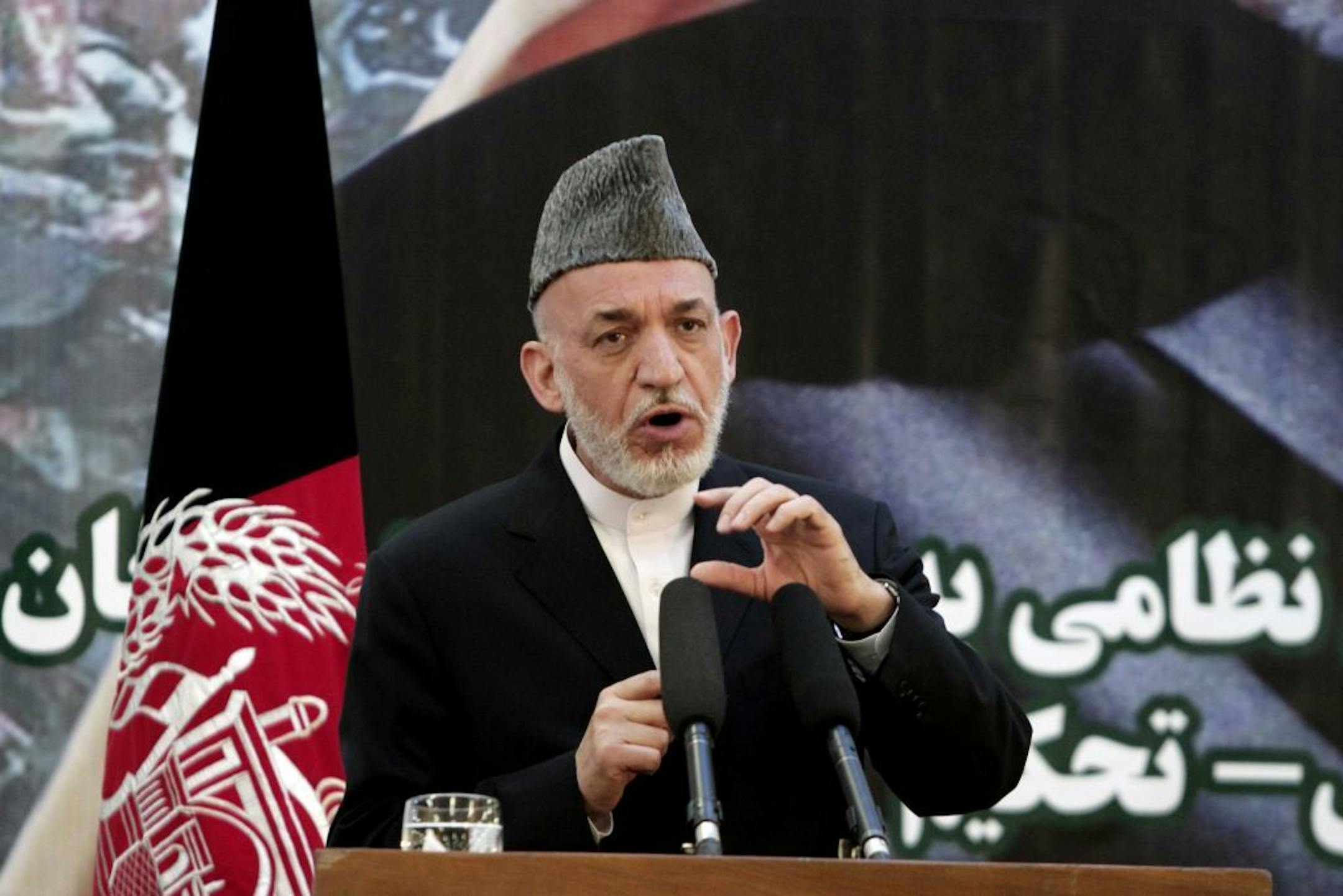 Afghan President Hamid Karzai speaks at a press conference during a ceremony at a military academy on the outskirts of Kabul, Afghanistan, Tuesday, June 18, 2013. Afghan forces have taken over the lead from the U.S.-led NATO coalition for security nationwide, Karzai announced in the significant milestone in the 12-year war.