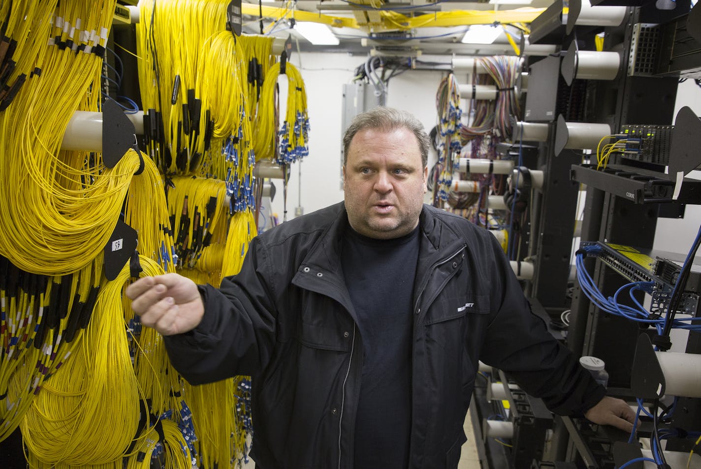 Travis Carter, the COO of US Internet, stands inside their fiber optic network switching station on Garfield Avenue near Lake Street in Minneapolis on Thursday, March 19, 2015. ] LEILA NAVIDI leila.navidi@startribune.com /