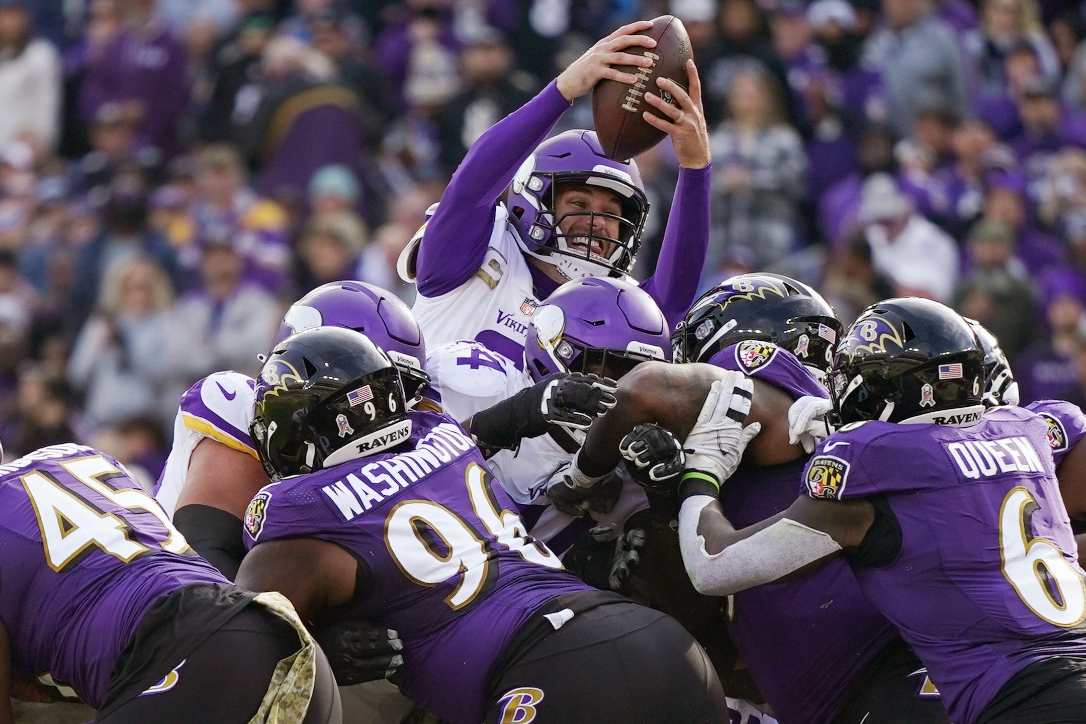Vikings quarterback Kirk Cousins (8) dove into the end zone for a touchdown in the second quarter of an NFL game between the Minnesota Vikings and the Baltimore Ravens Sunday, Nov. 7, 2021 at M&T Bank Stadium in Baltimore.