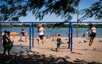 People enjoy the beach at Lake Nokomis in June, 2020.