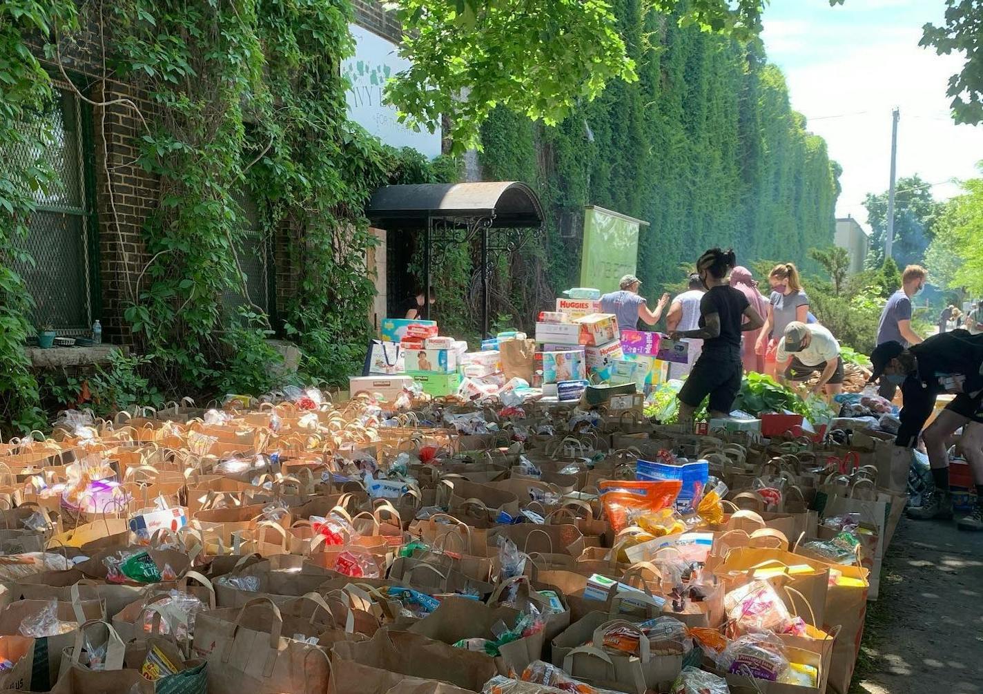 Hundreds of bags of food and supplies were dropped off outside the Ivy Building in south Minneapolis. Photo courtesy Samadhi Yoga MPLS