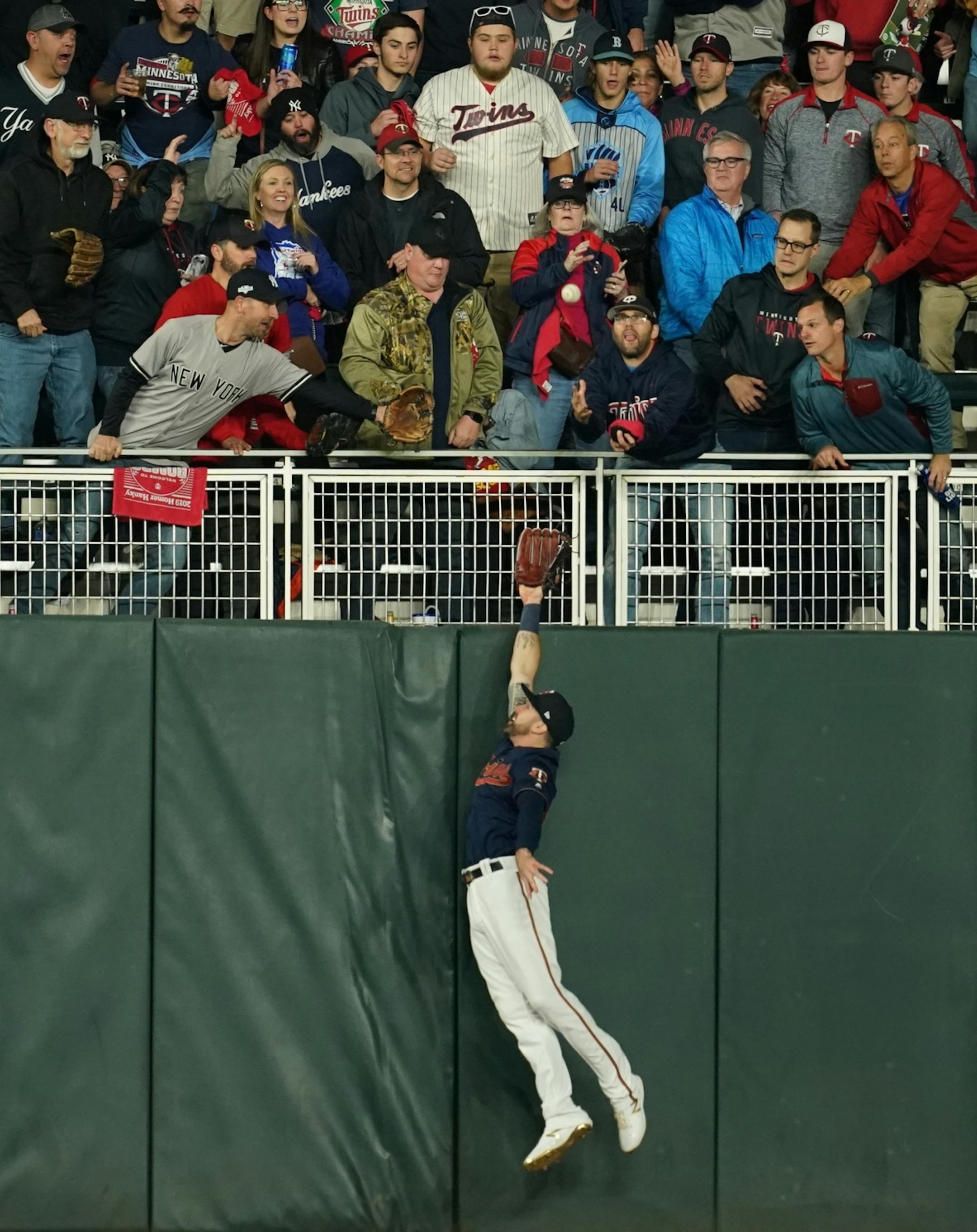 Minnesota Twins center fielder Max Kepler (26) missed the ball giving New York Yankees second baseman Gleyber Torres (25) a homer in the second inning.