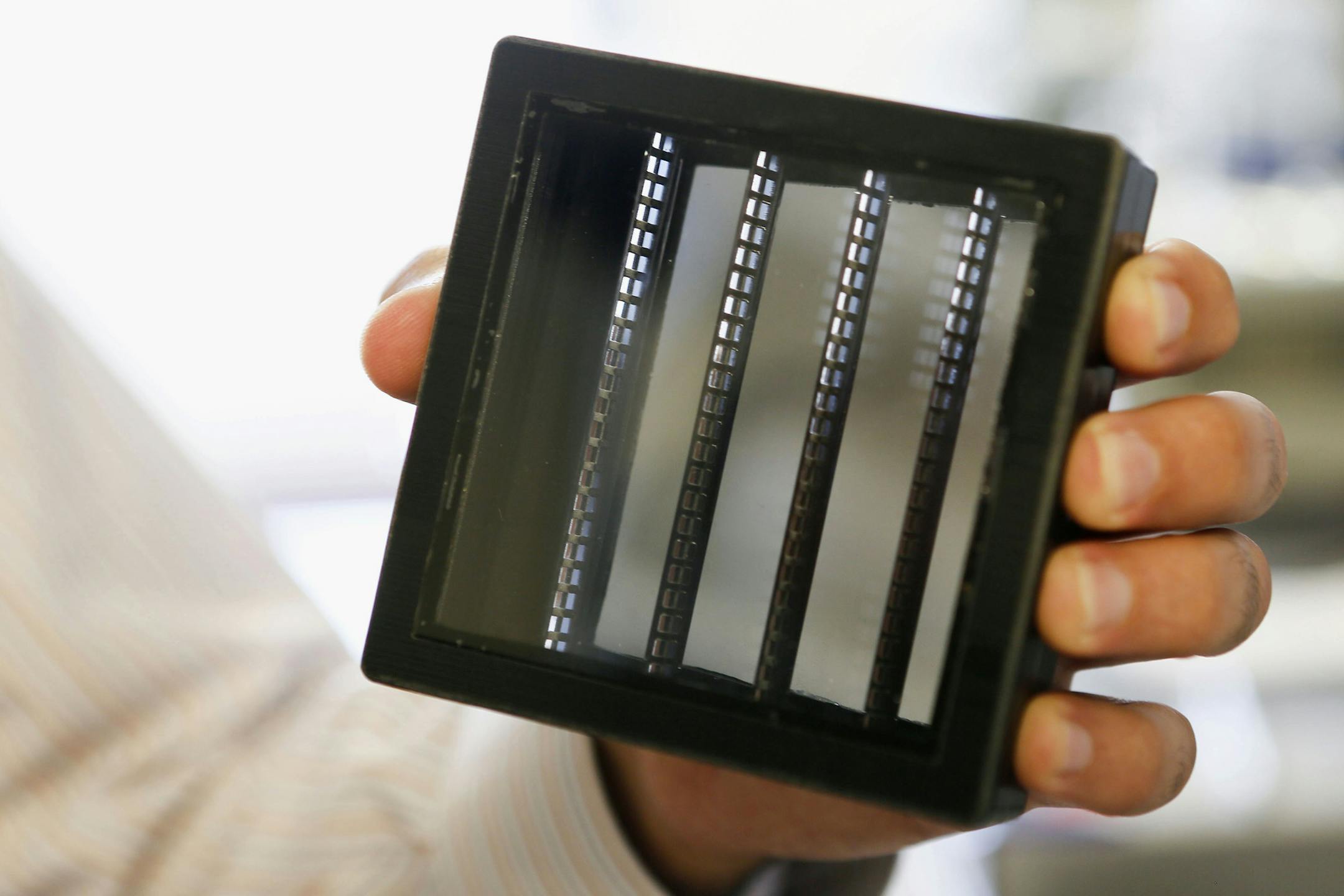 A prototype solar fuel generator is displayed for a photograph in the laboratory of the Joint Center for Artificial Photosynthesis at the California Institute of Technology (Caltech) in Pasadena, California, U.S., on Tuesday, July 9, 2013. Mimicking the way plants turn sunlight and carbon dioxide in the air into energy and oxygen, the Joint Center for Artificial Photosynthesis at the California Institute of Technology is in a race to trump nature and slow global warming. Photographer: Patrick T.