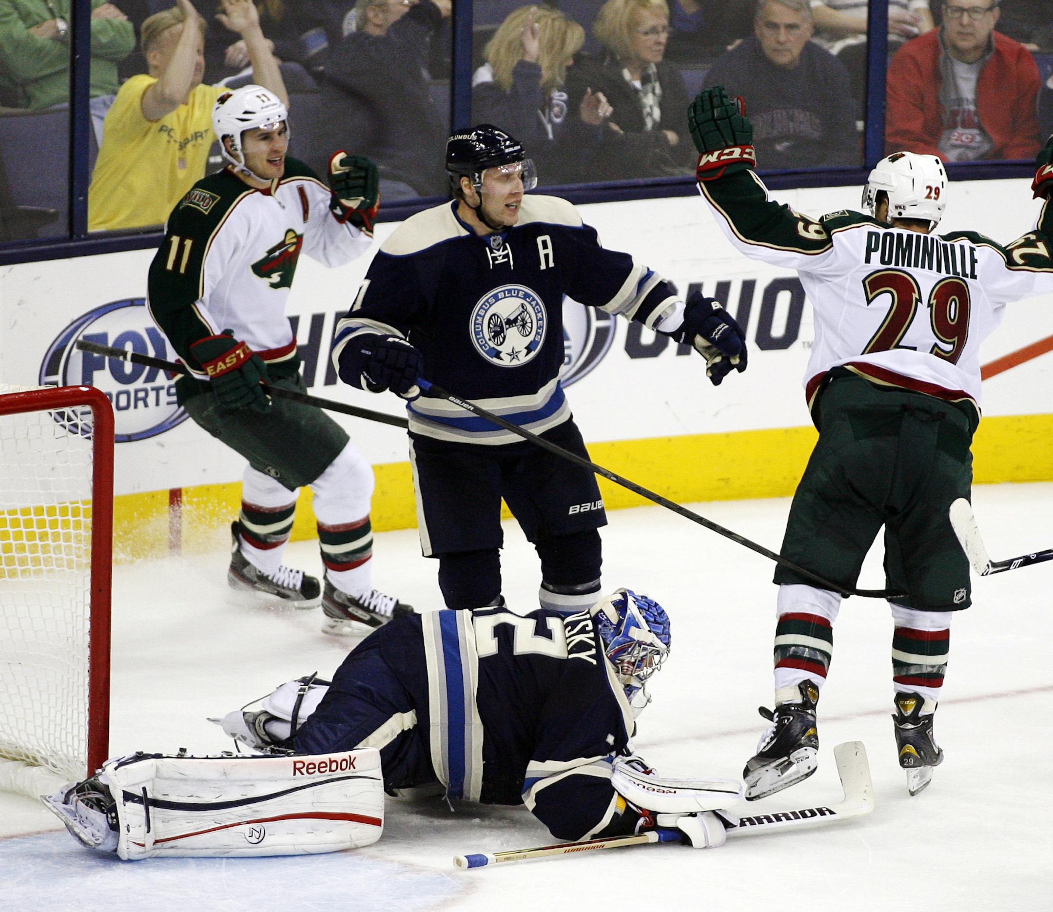 Columbus Blue Jackets goalie Sergei Bobrovsky (72) faces down after being scored on by Minnesota Wild's Jason Pominville (29) in the third period of an NHL hockey game, Sunday, April 7, 2013, in Columbus, Ohio. Blue Jackets' Jack Johnson (7) stands by as Wild's Zach Parise (11) celebrates. The Wild won 3-1. (AP Photo/Mike Munden)