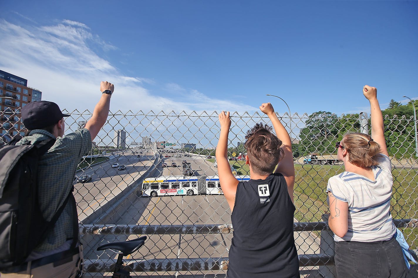 Protestors chanted on the University Avenue bridge as other protestors blocked and were arrested on the southbound interstate on 35W near the University Avenue bridge, Wednesday, July 13, 2016 in Minneapolis, MN.