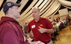 (left to right) Mark Santelman of Winthrop MN., talked with University of Minnesota Athletic Director Norwood Teague during the University of Minnesot