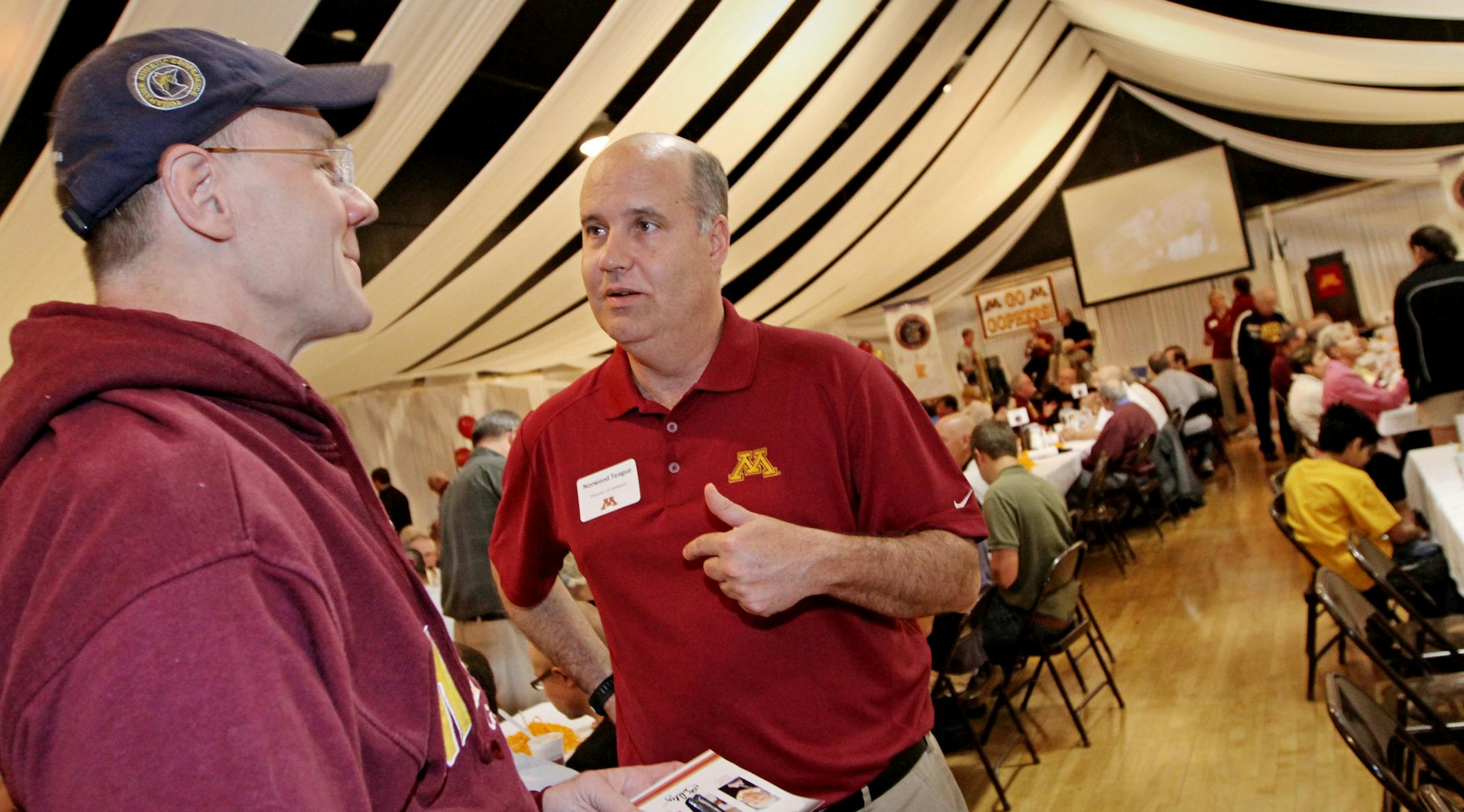 (left to right) Mark Santelman of Winthrop MN., talked with University of Minnesota Athletic Director Norwood Teague during the University of Minnesota athletics big spring/summer caravan stop in New Ulm, in which administrators and coaches visited several non-metro sites to build bridges and potentially cultivate donors. Photographed on 5/17/13, New Ulm Minnesota.] Bruce Bisping/Star Tribune bbisping@startribune.com Mark Santelman, Norwood Teague/source.