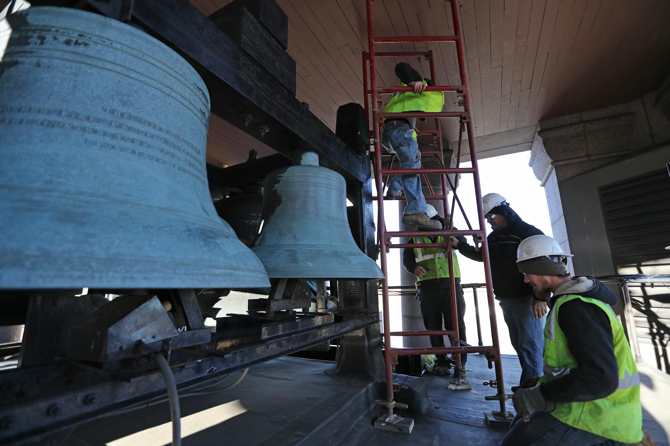 Workers from DG Welding and Versacon began reinforcing the support system that holds up the fifteen bells inside the tower at Minneapolis City Hall. The bells weigh between 300 and 7,000 pounds each. ] Shari L. Gross � shari.gross@startribune.com The bells at the Minneapolis City Hall/Hennepin County Courthouse will stop ringing so crews can reinforce the bell support system. The work will last approximately three weeks.