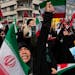 Iranian worshippers chant slogans during an anti-Israeli gathering after Friday prayers in Tehran, Iran, Friday, April 19, 2024. An apparent Israeli d