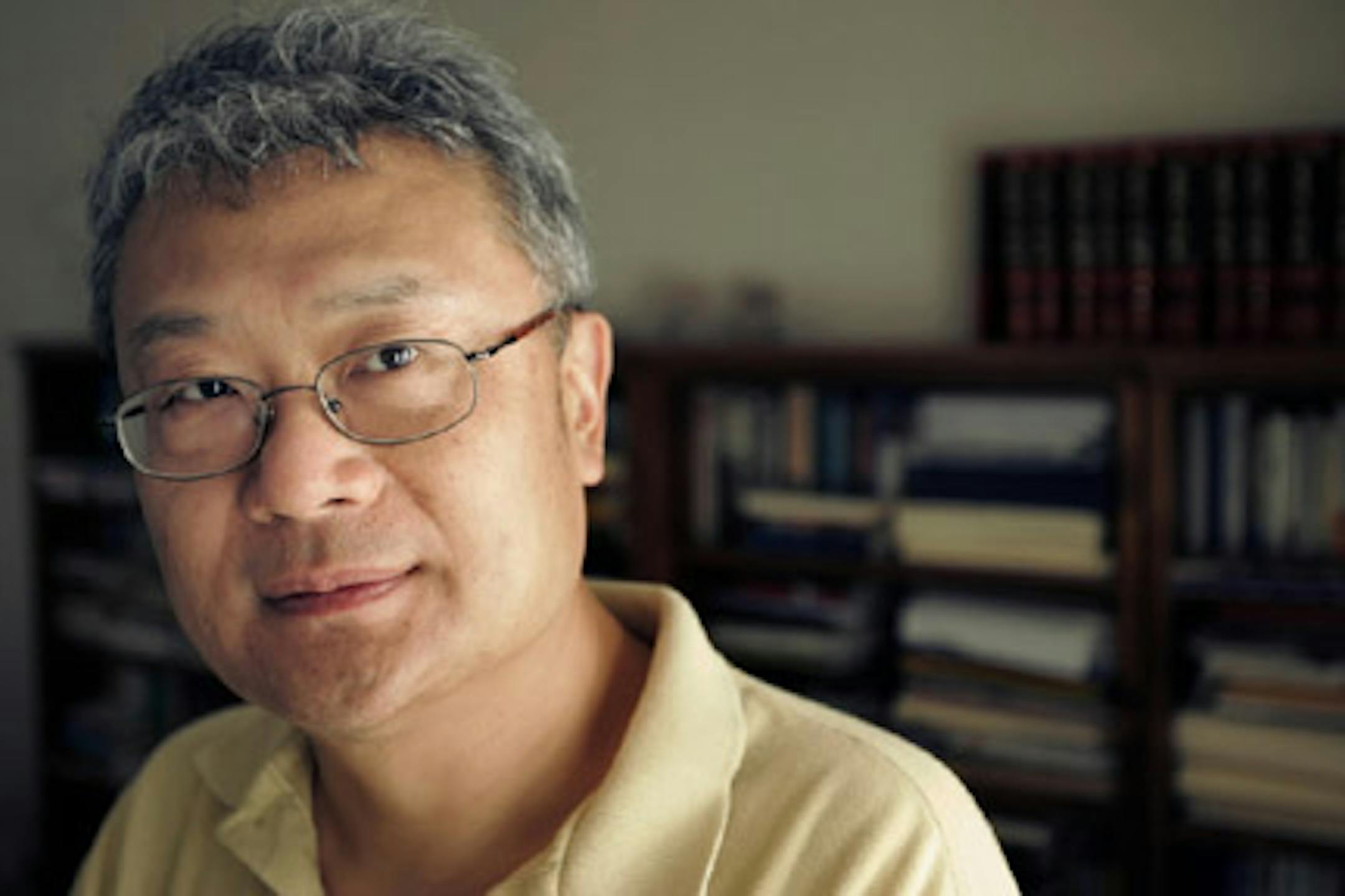 ** ADVANCE FOR WEDNESDAY NOV. 28 ** Writer Ha Jin poses in the study of his home in Foxborough, Mass., Monday, July 30, 2007. (AP Photo/Steven Senne) ORG XMIT: NY343