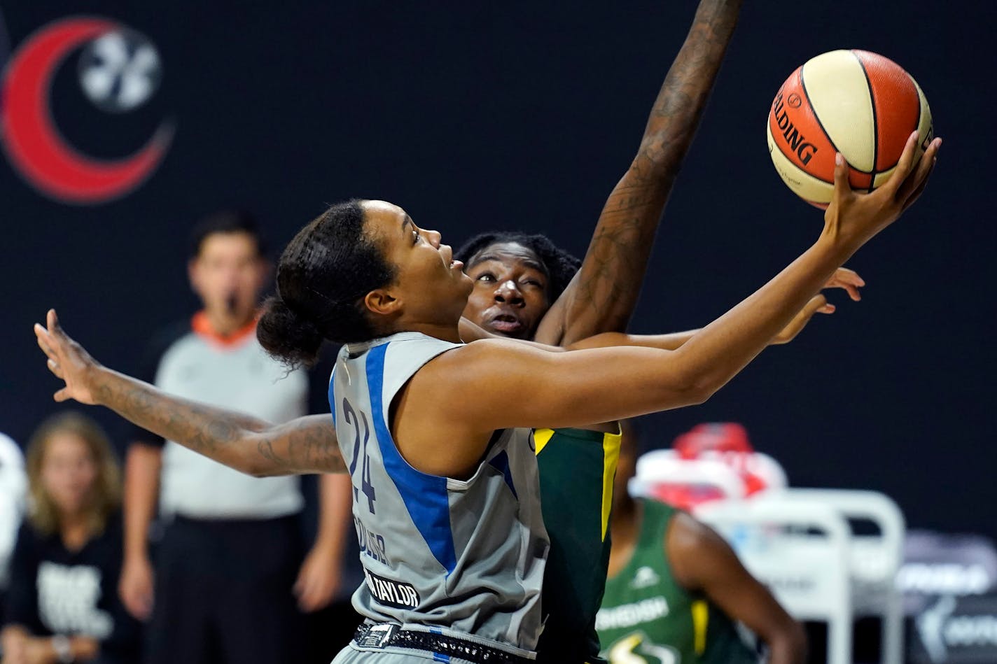 Lynx forward Napheesa Collier goes up for a shot in front of Seattle forward Natasha Howard.