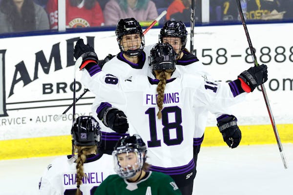 Minnesota PWHL’s Sophia Kunin (11), at top left, celebrated with teammates Brittyn Fleming (18) and Liz Schepers (21) on Wednesday night, Kunin scor