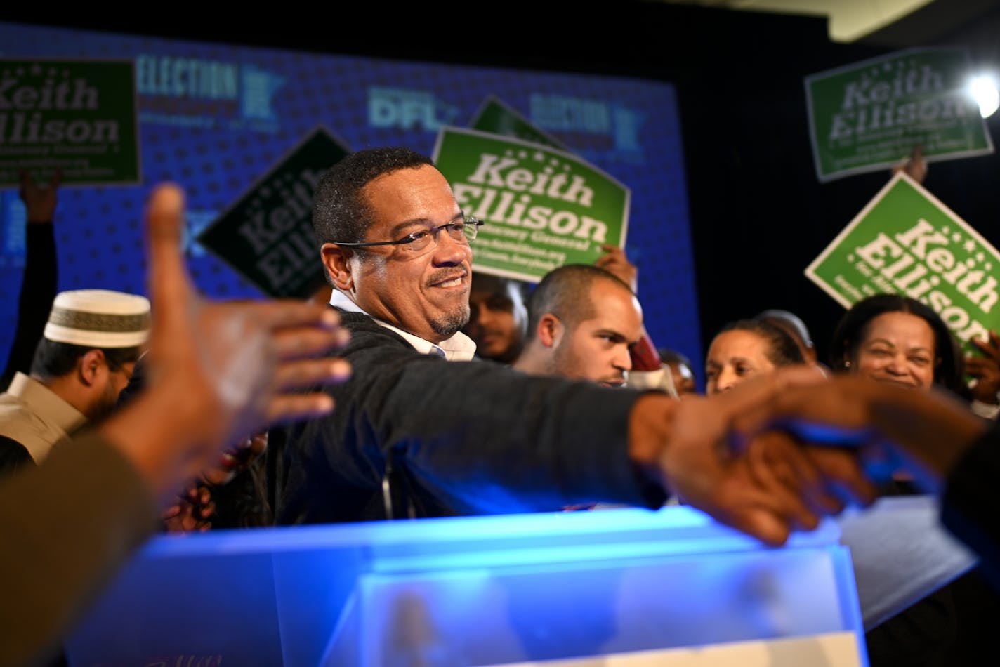 Attorney General-elect Keith Ellison shook a supporters hand after giving his acceptance speech at the DFL headquarters election party Tuesday night.