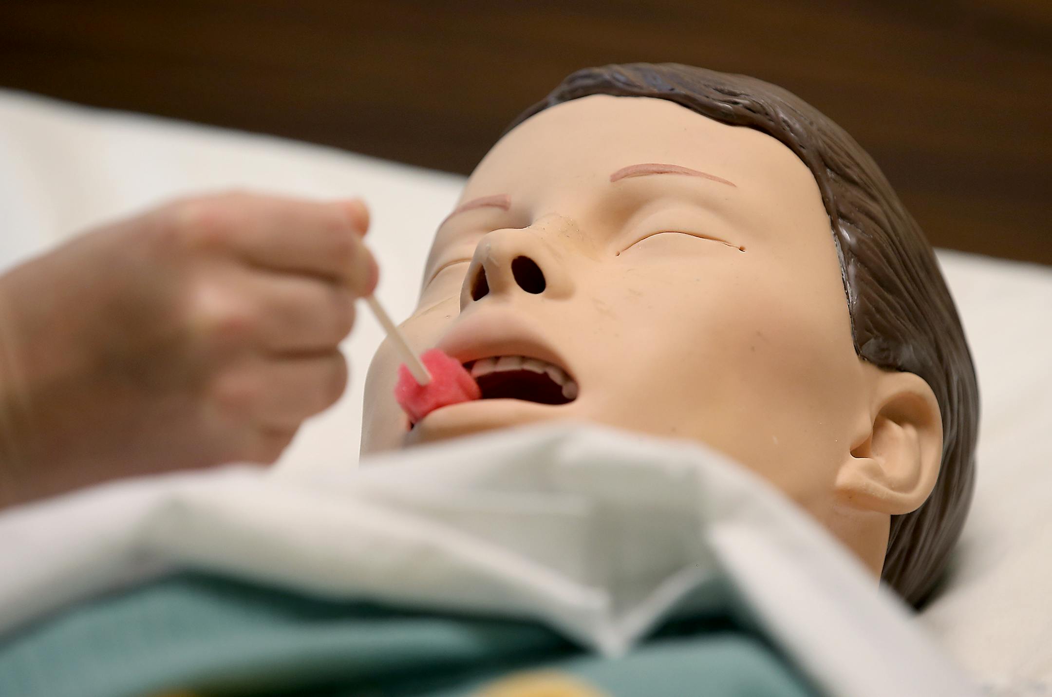 Normandale Community College nursing students worked on a lifelike, high-tech mannequin during class on hospice care, Thursday, April 23, 2015 in Bloomington, MN. ] (ELIZABETH FLORES/STAR TRIBUNE) ELIZABETH FLORES • eflores@startribune.com