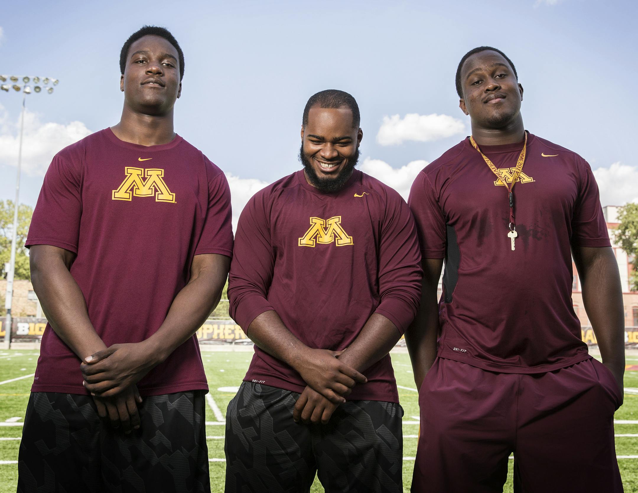 Gophers football players Hendrick Ekpe, from left, Rodrick Williams, Jr. and Scott Ekpe, who all played together in high school in Lewisville, Texas, photographed at the Gibson-Nagurski Football Facility at University of Minnesota in Minneapolis on Tuesday, August 4, 2015. ] LEILA NAVIDI leila.navidi@startribune.com /