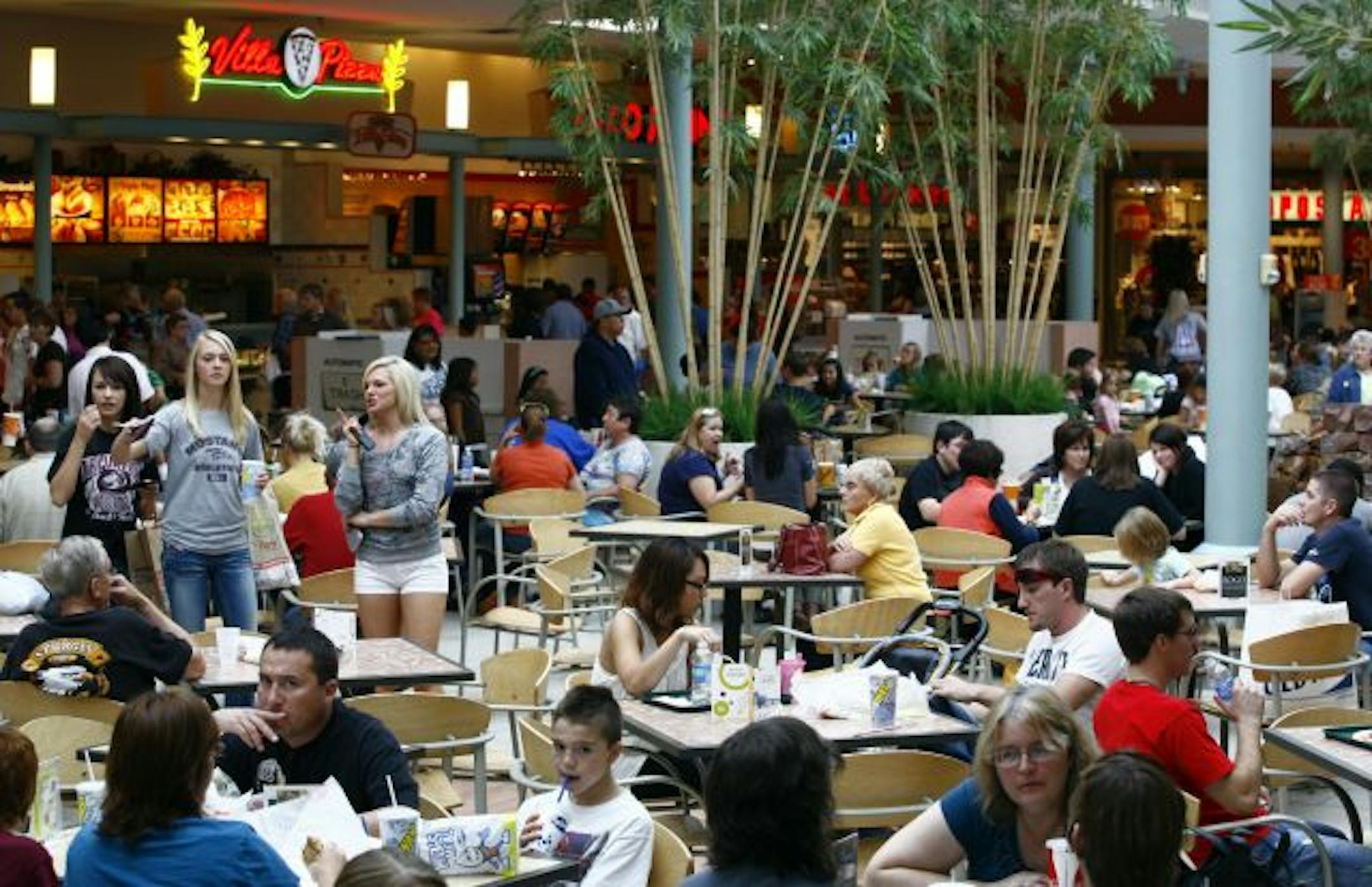 People dine in the food court at the Empire Mall in Sioux Falls, S.D