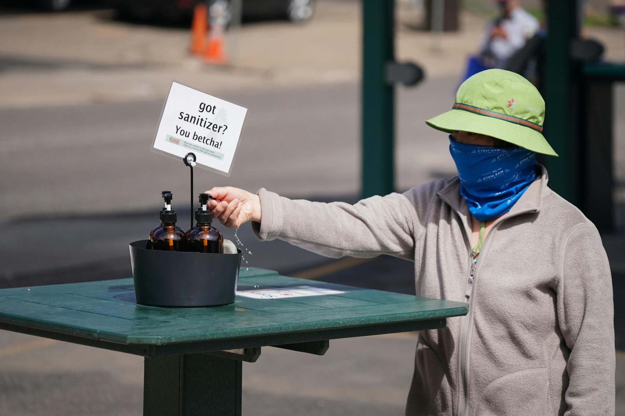 Safety precautions were in place at the Minneapolis Farmers Market on Saturday, May 2, 2020, including hand sanitizer stations, directional markers for pedestrians and signs reminding to stay 6 feet apart.