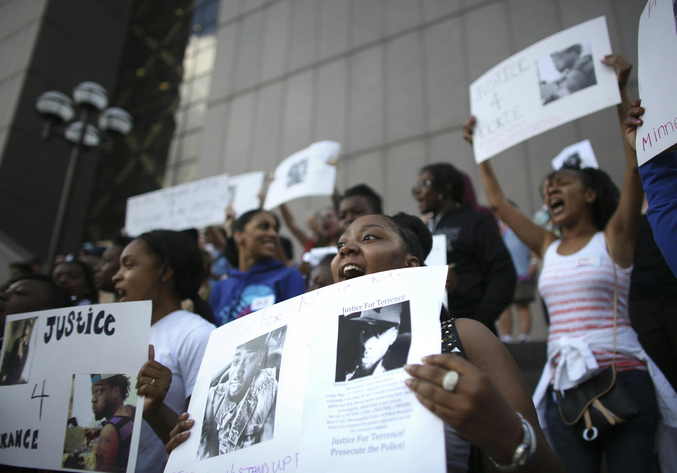 Brandy Tate, a friend of Terrence Franklin, chanted with the rest of the crowd "No justice no peace" during a rally for Franklin, who was shot and killed by police at the Hennepin County Government Center in Minneapolis Min., Friday, May 31, 2013. ] (KYNDELL HARKNESS/STAR TRIBUNE) kyndell.harkness@startribune.com