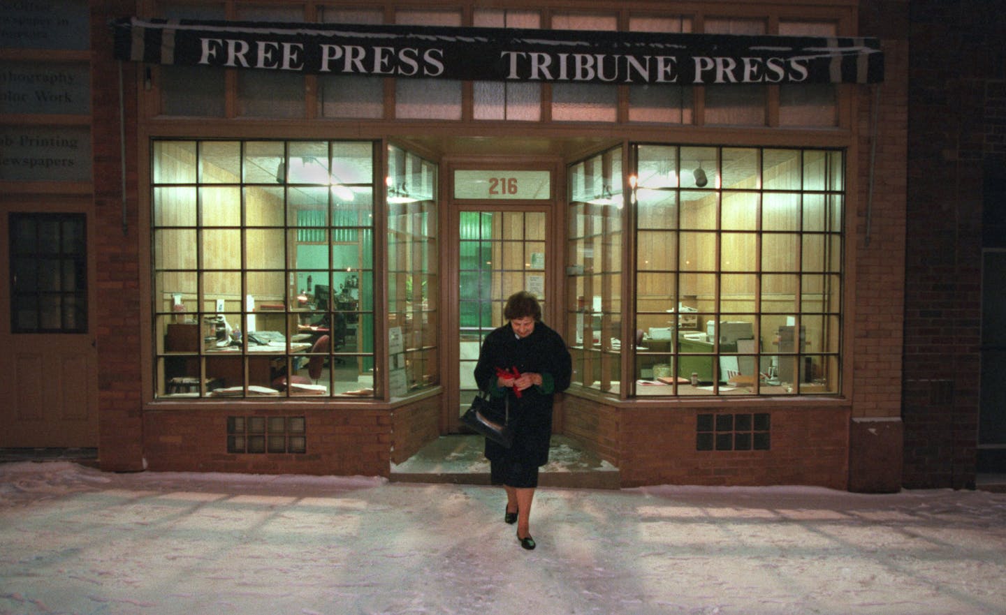 At the end of another day's work, Veda Ponkivar leaves the offices of the Chisholm newspapers she has owned and operated for 49 1/2 years. She has recently sold the papers to an investor from Wisconsin, but still contributes articles and editorials to the paper. She insists that it was time to sell, but she is not about to give up boosting the town of Chisholm. She remains active in the schools and on various community and civic boards and committees.