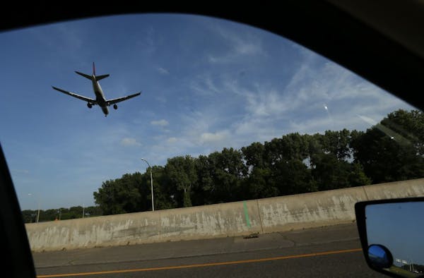 A plane crossed over Highway 62 as it prepared to land at Minneapolis St. Paul International Airport in 2013.