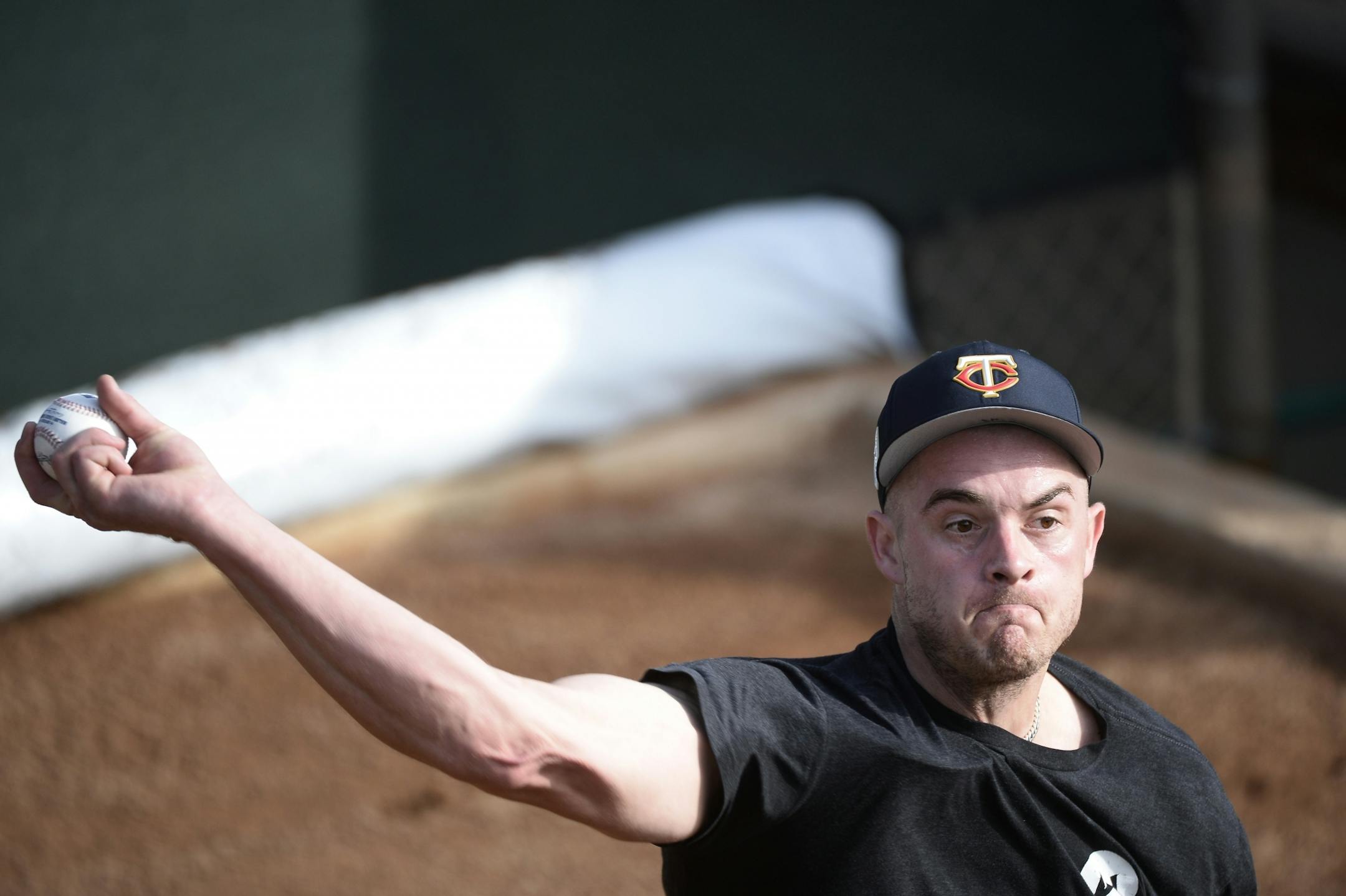 Twins pitcher Jake Reed warmed up in the bullpen on report day.