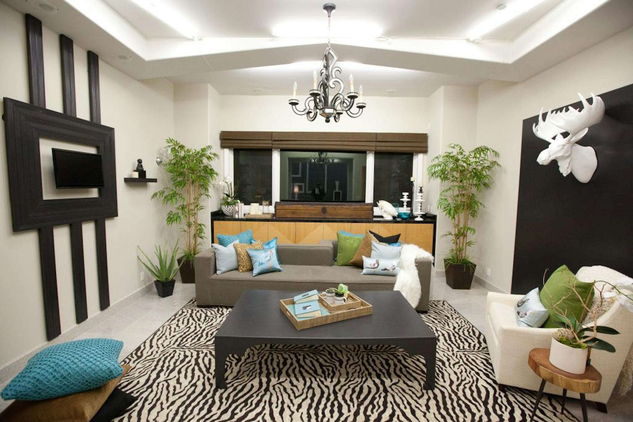 For the first challenge, the designers are paired up into teams and assigned the task of making over a room in the Los Angeles home where they will live during the competition. In addition, the designers were told to bring an item that represents them that they must incorporate into the design. Shown here is After Photo 1 of the Den designed by Hilari Younger and Rachel Kate as seen on HGTV Design Star season 7.
