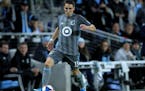 Minnesota United defender Ethan Finlay passes against the LA Galaxy during the second half of an MLS first-round playoff soccer match Sunday, Oct. 20,