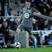 Minnesota United defender Ethan Finlay passes against the LA Galaxy during the second half of an MLS first-round playoff soccer match Sunday, Oct. 20,