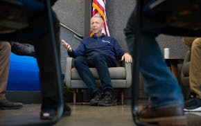 Mayor Dave Kleis speaks with a small group during a 24-hour town hall inside St. Cloud City Hall on Saturday.