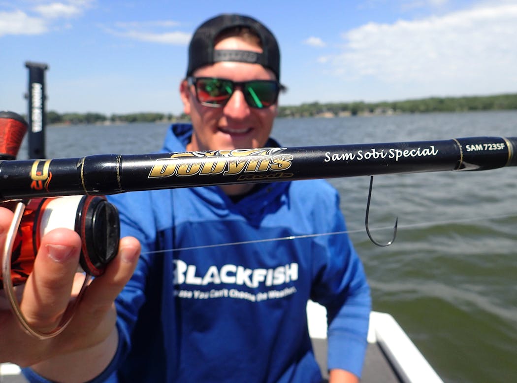 Minnesota fishing YouTuber Sam Sobieck has a growing base of followers for his fun-loving “Sobi” videos that mix entertainment with fishing instruction in well-produced segments. Here he holds a bass fishing rod manufactured by one of his marketing partners. Dobyns of Texas.