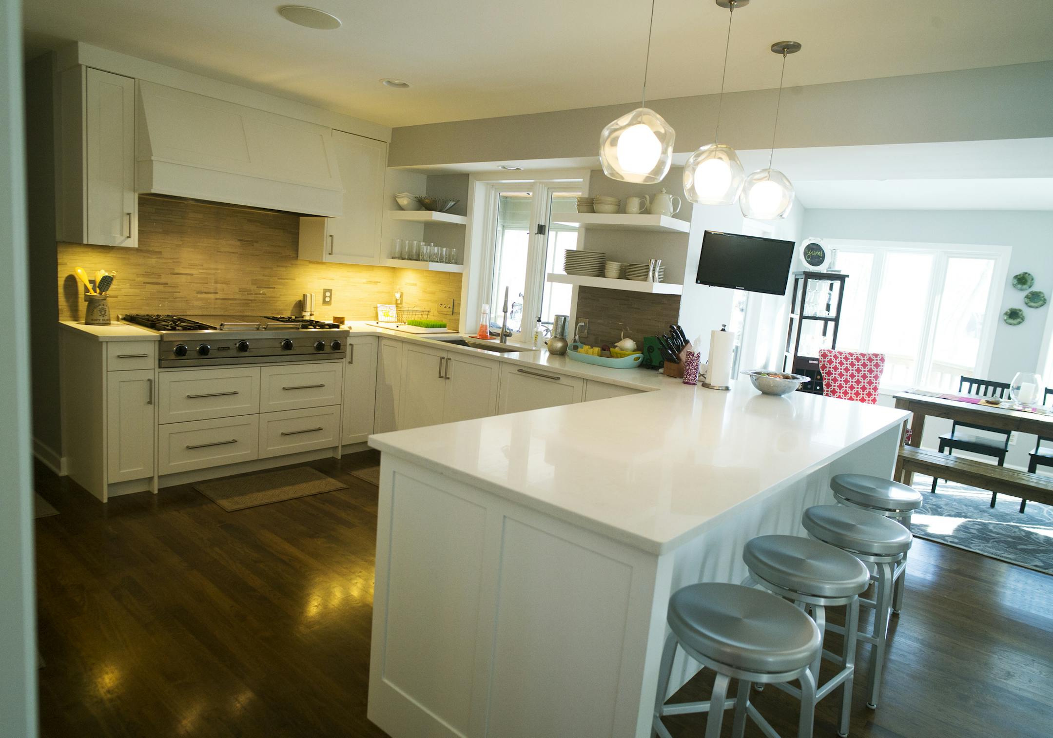 Angela and Ricky Brown show off their remodeled home, the one Ricky grew up in. The kitchen was completely gutted for a more ergonomic layout.]Richard Tsong-Taatarii/rtsong-taatarii@startribune.com