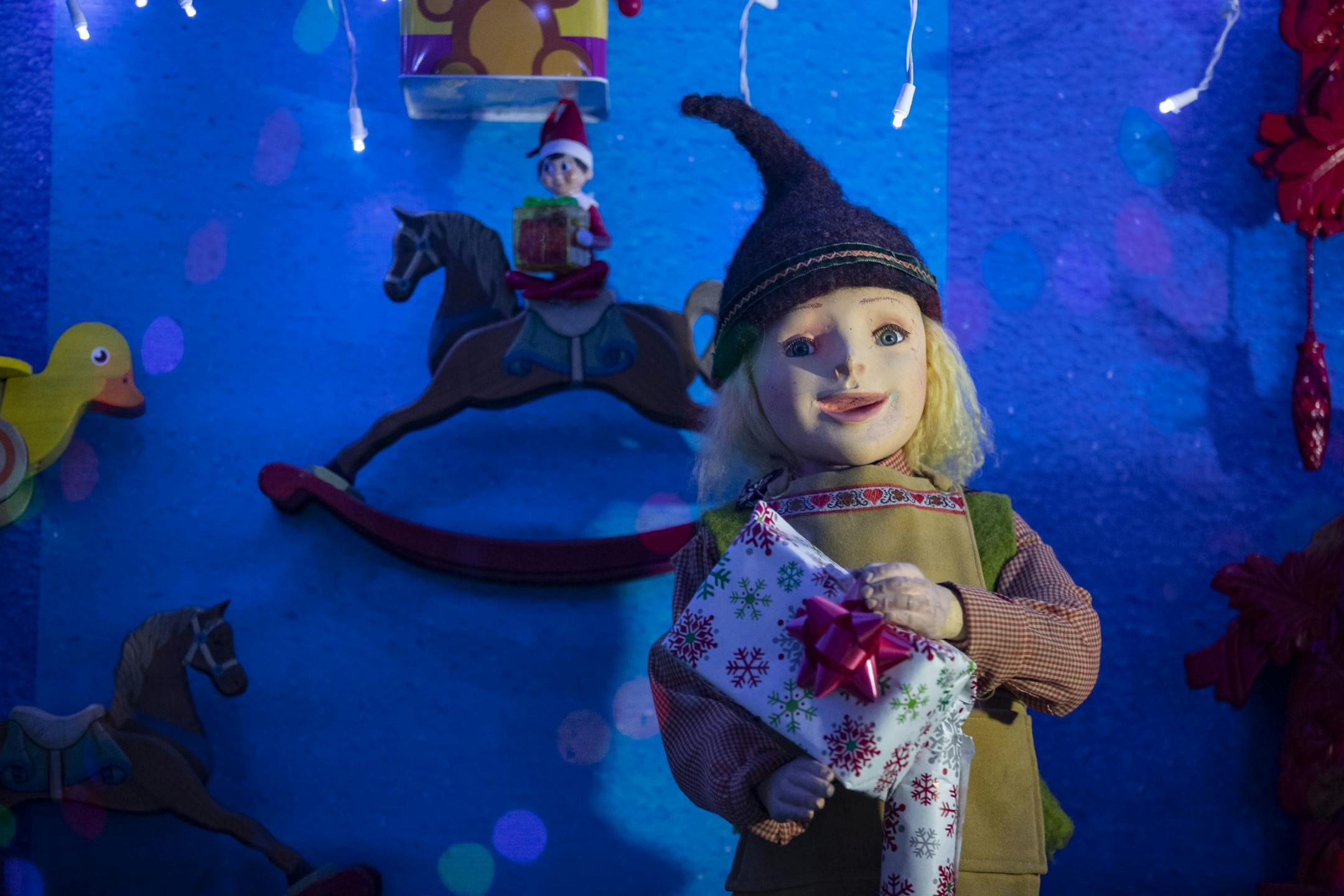 An animatronic elf holding a present moved in a faux TV set in Bentleyville on Tuesday December 3, 2019.