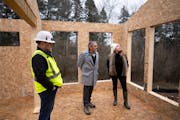 CEO of Greensmith Aaron Smith explained some of the features of a green home he is building nto broker Richard McDonough and designer and developer Am